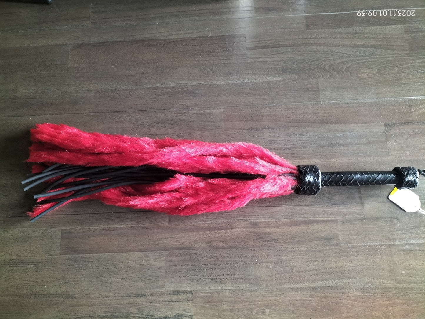Faux fur flogger with nasty rubber falls incorporated