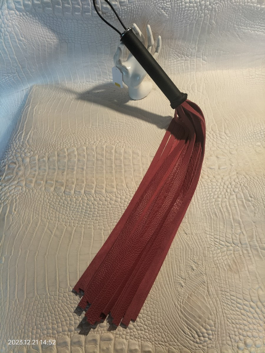 Red leather flogger with black leather handle