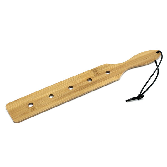Wooden paddle with holes