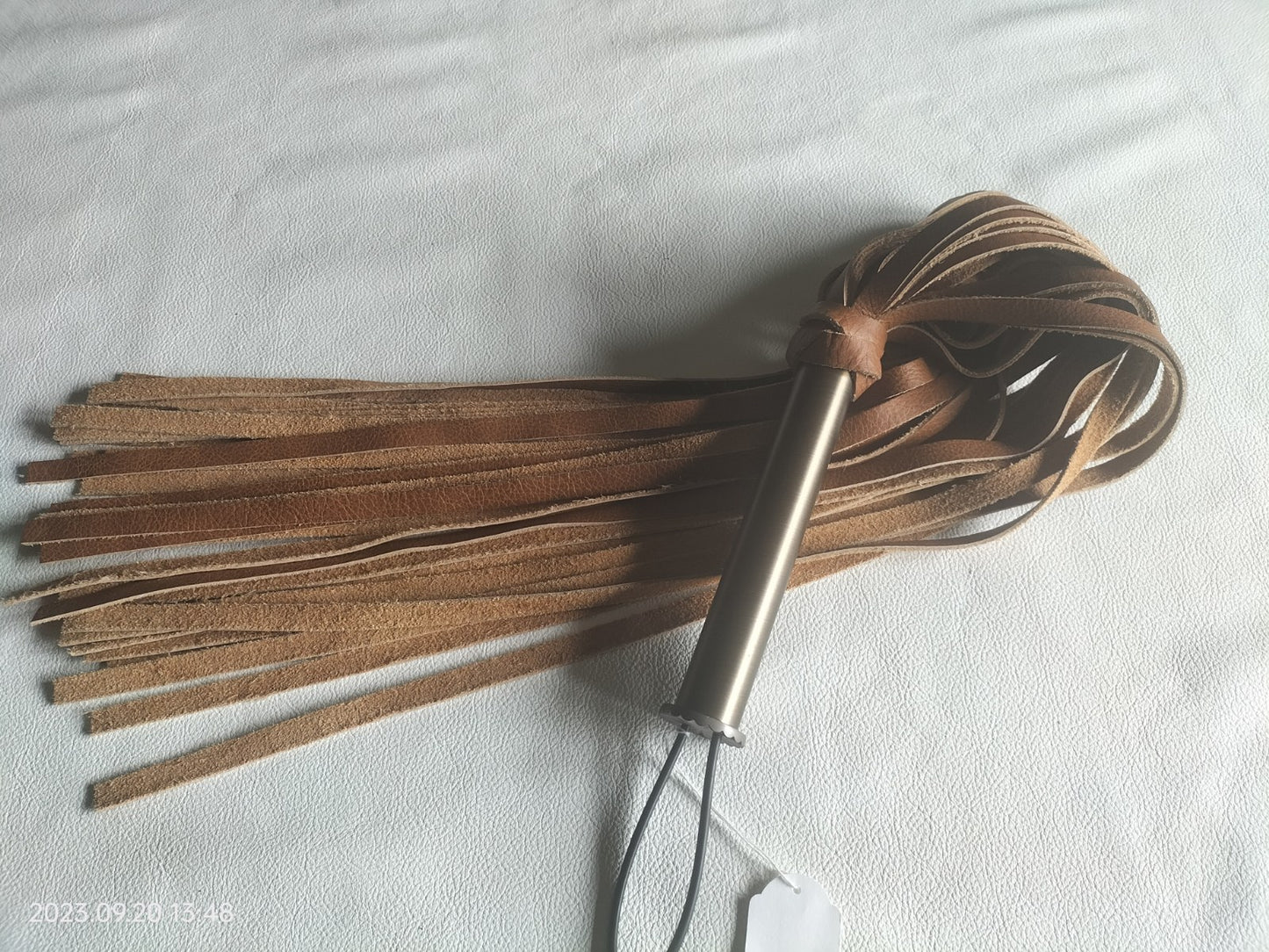 Cognac buffalo leather flogger 70cm with bronze-colored handle