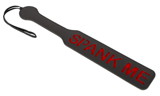 Paddle with text "SPANK ME"