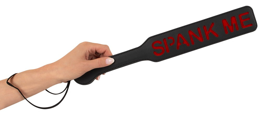 Paddle with text "SPANK ME"