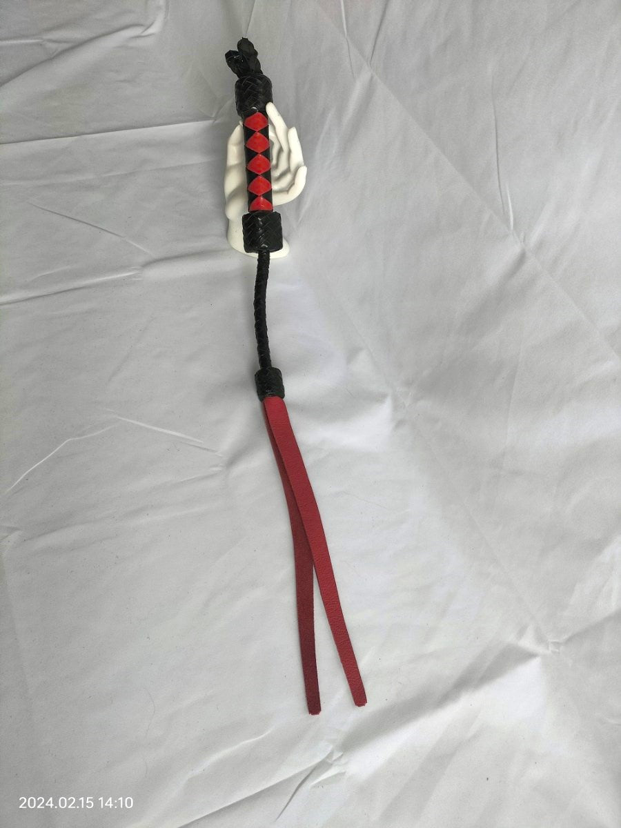 Short whip with forked red tongue