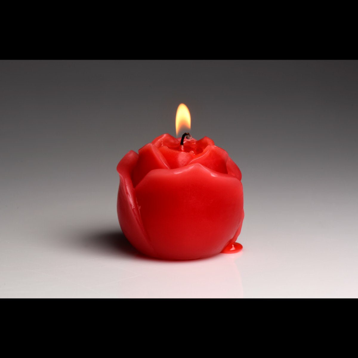 Rode druppelkaars roos - SM - speeltjes