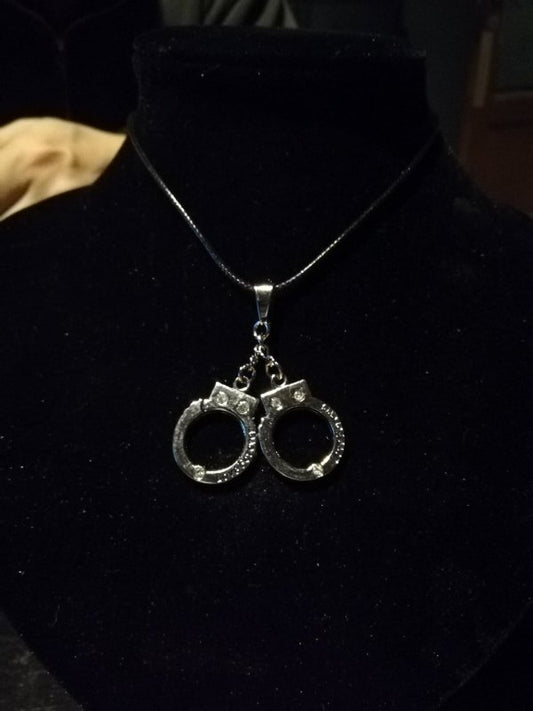 Leather necklace with large handcuffs