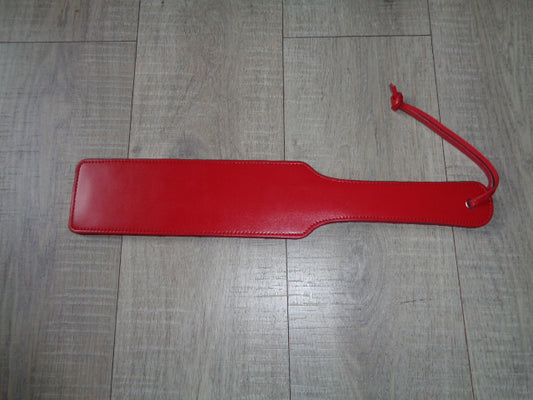 Long red leather paddle