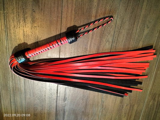 Heavy red/black flogger with red woven handle