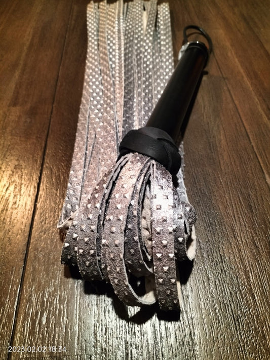 silver-colored calfskin flogger with stud motif
