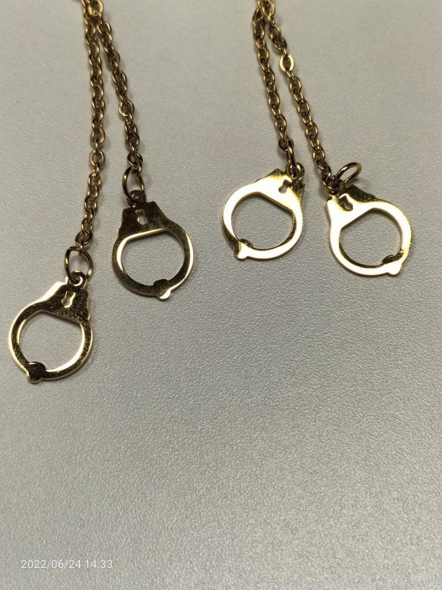 RVS oorbellen ketting met handboeien goudkleurig - SM - speeltjes